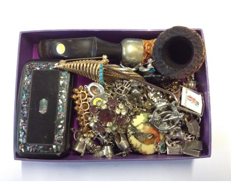 A box of costume jewellery including silver charms, snuff box etc. C