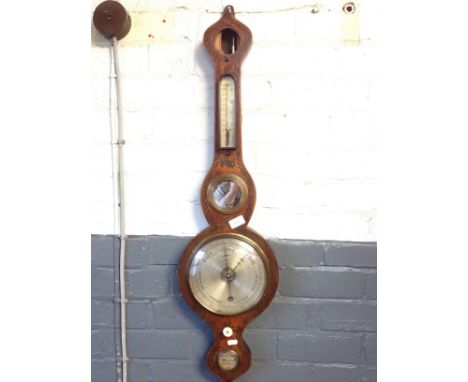 A Georgian wheel barometer.