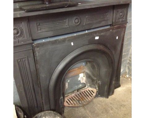 A cast iron fire surround and insert.