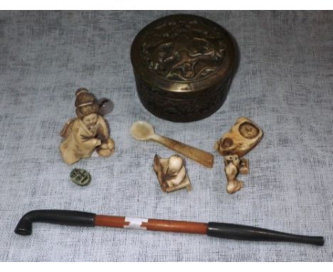 A WHITE METAL AND BAMBOO OPIUM PIPE, a repousse metal box, carved bone figures and other items