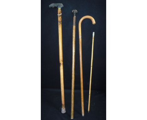 A ROYAL ENGINEERS SWAGGER-STICK, a ram's head decorated walking stick and two other walking sticks