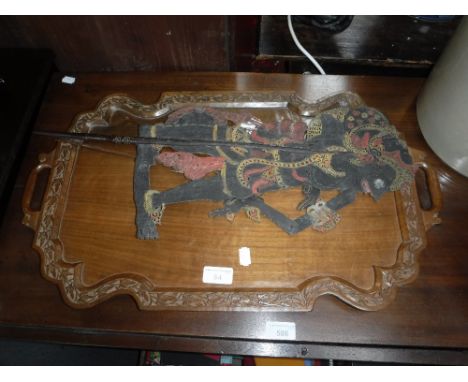 A CARVED HARDWOOD TRAY and a Thai shadow puppet 