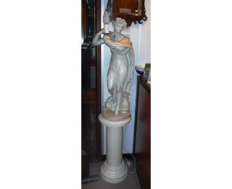 A CREAM PLASTER STUDY OF A GRECIAN WOMAN holding a lamp, (fitted for electricity) standing on a similar column 64" high (incl