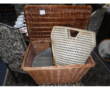 A WICKER HAMPER and a collection of similar baskets