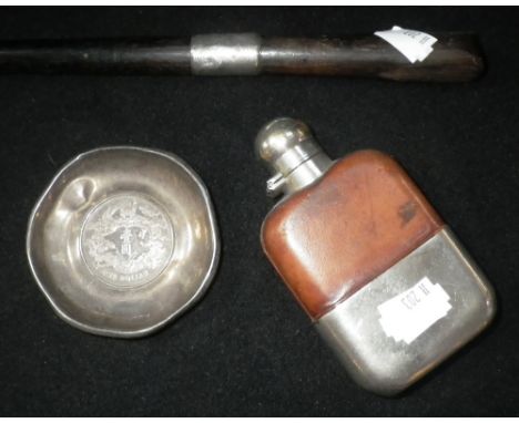 A LEATHER COVERED HIP FLASK with plated top and base, a Chinese one dollar coin, inset within a (silver?) dish and a (part) h