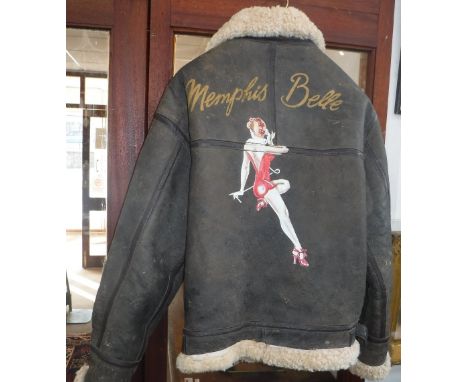 A BROWN LEATHER FLYING JACKET with fleece lining, with 'Memphis Belle' pin-up on the back (Marked size 'M')