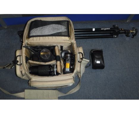 A YASHICA 230-AF CAMERA with accessories in a camera bag, with tripod
