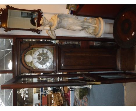 AN OAK CASED EIGHT-DAY LONGCASE CLOCK by Wm Davis, Dorchester, with brass dial and silvered chapter ring and arched hood door