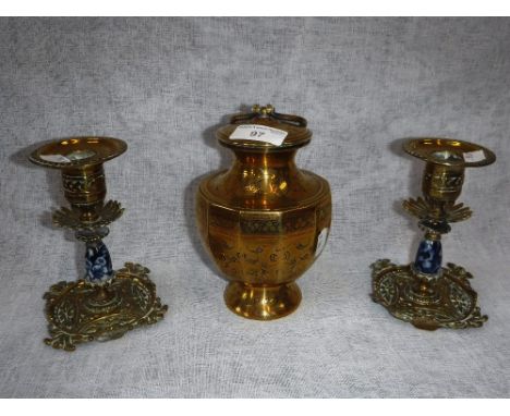 AN INDIAN BRASS POT AND COVER and a pair of Victorian brass and ceramic candlesticks