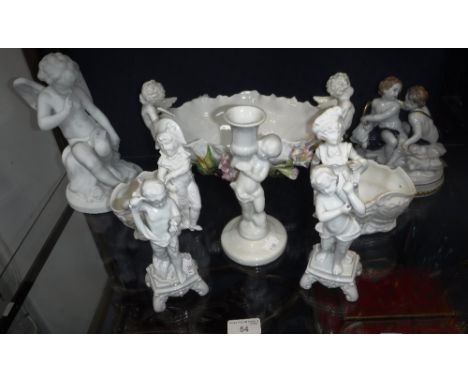 A CONTINENTAL CERAMIC CENTRE PIECE, decorated with cherubs and flowers and a collection of decorative figures and ceramics