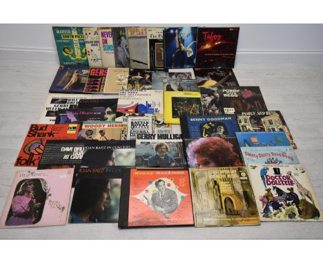 A collection of late 20th century record albums, to include; Bob Dylan, Simon &amp; Garfunkel, Noel Coward, Dusty Springfield