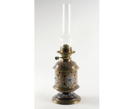 A DOULTON STONEWARE OIL LAMPDated 1878 Cylindrical form, incised with foliage and applied with flowerheads against a brown wa