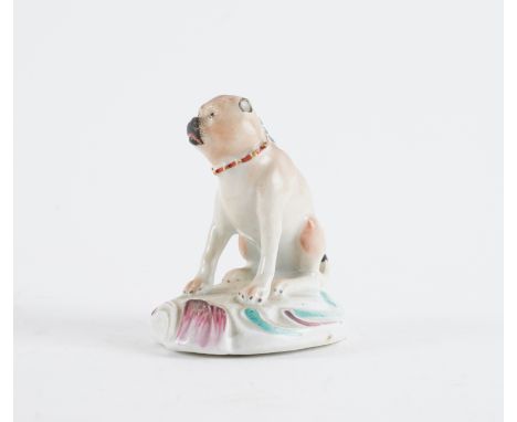 A DERBY PORCELAIN FIGURE OF A PUG DOGCirca 1765 Modelled seated on a scroll moulded base picked out in turquoise and puce, pa