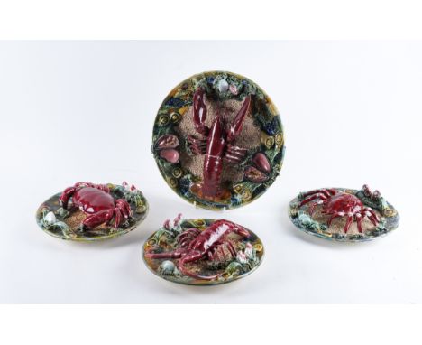 FOUR PORTUGUESE PALISSY STYLE PLATES20th century Comprising of a large plate applied in high  relief with a lobster, mussels 