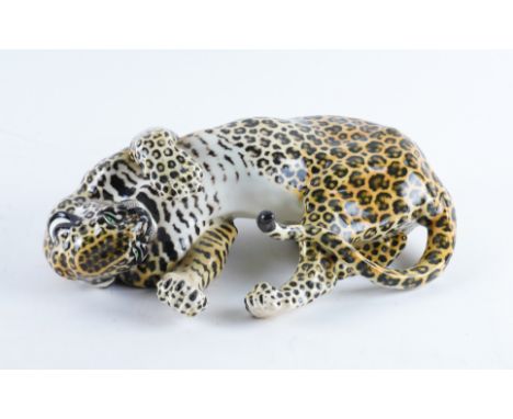 A NYMPHENBURG PORCELAIN FIGURE OF A LEOPARD `AMIDOU'20th century First designed by Hans Behrens in 1904, naturalistically mod
