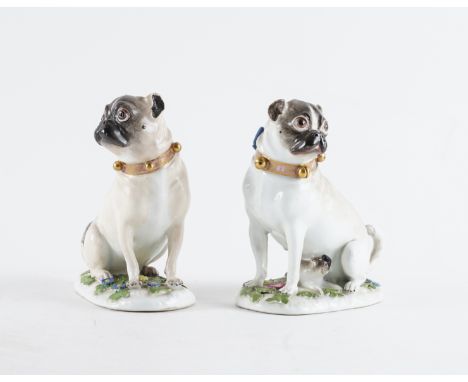 TWO MEISSEN PUG DOGS (2)Circa 1745-50 Modelled by J.J. Kaendler, each modelled seated with tails curled, wearing puce and gil