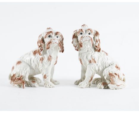 A PAIR OF NYMPHENBURG FIGURES OF BOLOGNESE TERRIERS (2)20th century Each brown and white dog seated facing to the left or rig