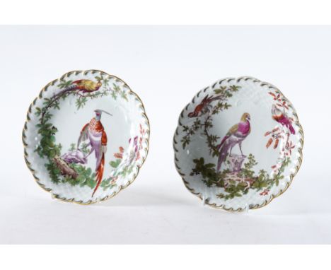 A PAIR OF CHELSEA PORCELAIN PLATES (2)Gold anchor period, circa 1760 Each painted with exotic birds inside a moulded scale pa