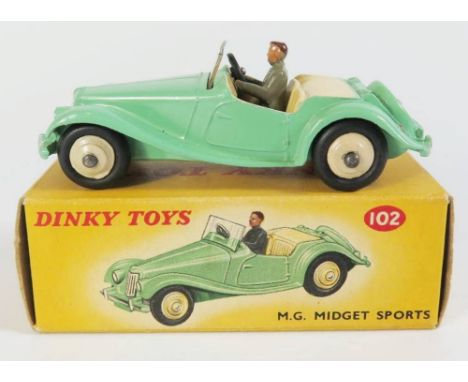Dinky 102 MG Midget in pale green with cream interior, cream hubs and grey driver, boxed