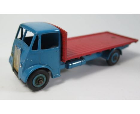 Dinky 512 Guy Flat Truck first type in light blue with red flatbed and grooved blue hubs