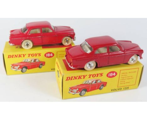 Two Dinky 184 Volvo 122 S Cars _ one in darker red boxed, the other lighter