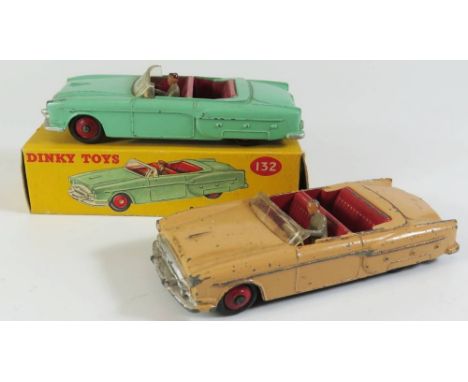 Two Dinky 132 Packard Convertibles one in light green, boxed and one salmon pink