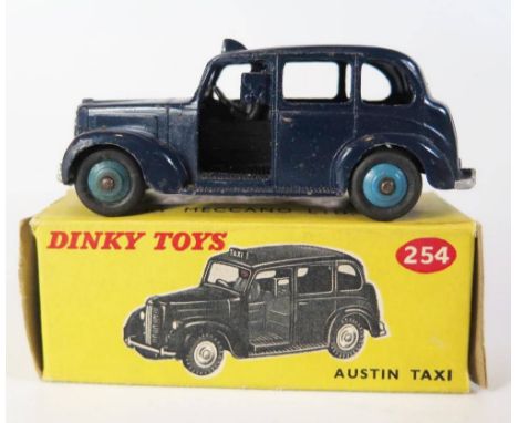 Dinky 40h / 254 Austin FX3 Taxi in dark blue with light blue hubs, box