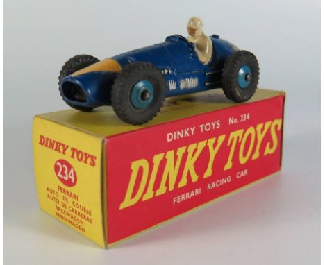 Dinky 234 Ferrari Racing Car in deep blue with yellow arrow nose cone, 234 gloss base and blue cast hubs, boxed