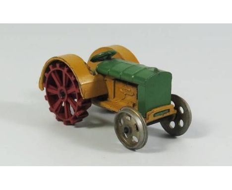Dinky 22e Farm Tractor in green and yellow with red rear and unpainted front wheels