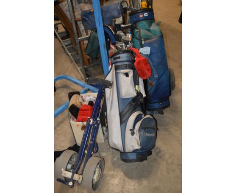 THREE GOLF BAGS WITH CLUBS, a trolley and an electric caddy (no battery) 