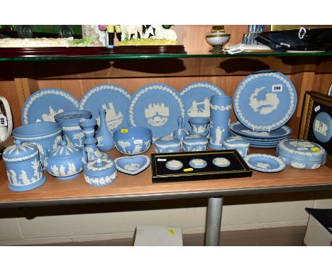 A GROUP OF WEDGWOOD JASPERWARES, to include Christmas plates 1969 to 1978, two mounted and framed medallions, vases, candlest
