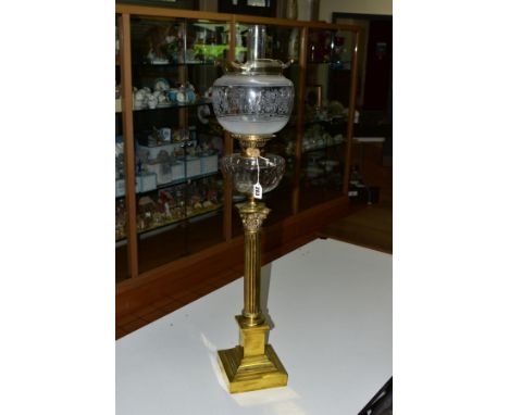 A VICTORIAN BRASS OIL LAMP, corinthian column with stepped base, cut glass reservoir, glass funnel and a glass shade, total h