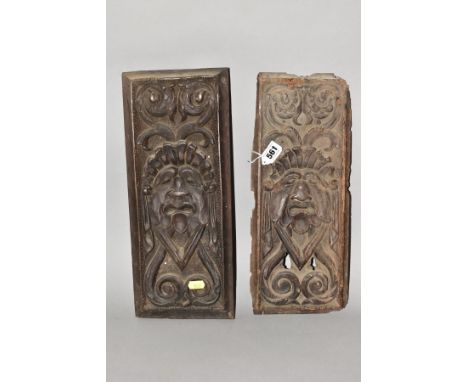 TWO CARVED TREEN PANELS, of rectangular form, 17th Century and later, carved with identical mask and scroll motifs, one oak t