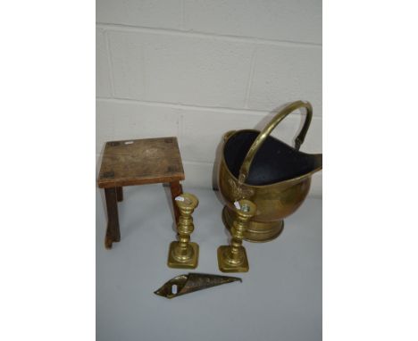 A BRASS LOG BUCKET, together with a pair of brass candlesticks, an oak milking stool, glass lamp shade, etc (6)