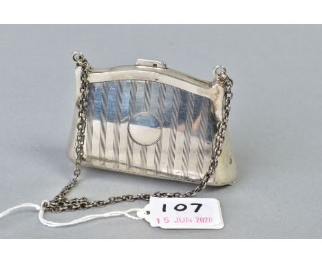 A GEORGE V SILVER PURSE, engine turned decoration, fabric lined interior, on a chain and finger ring, makers Horton &amp; All