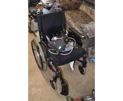AN ACTION 3 ELECTRIC WHEEL CHAIR (spares and repairs), three chargers, a manual wheel chair and a bag of foot rests (6)