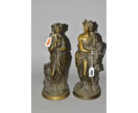 A PAIR OF 19TH CENTURY CONTINENTAL BRONZE FIGURES, in the form of a classical male holding a companion wearing long robes, bo