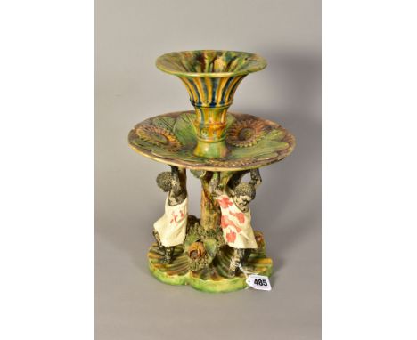 A LATE 19TH CENTURY JOSE A. CUNHA MAJOLICA CENTREPIECE, the trumpet shaped central vase above a circular tier moulded with th