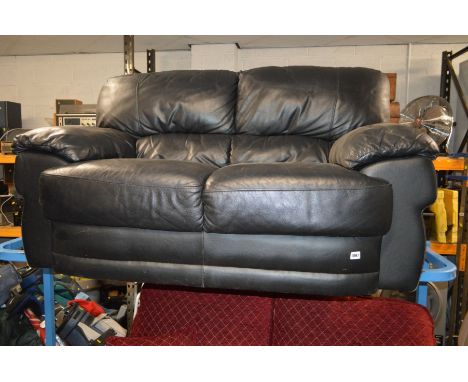 A BLACK LEATHER TWO SEATER SOFA, width 145cm (no feet)