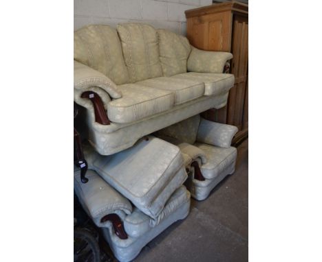 A MINT GREEN FLORAL PATTERNED THREE PIECE SUITE consisting of a three seater sofa, width 205cm, two armchairs, width 105cm an