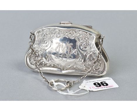 AN EDWARDIAN SILVER PURSE, foliate scroll decoration cartouche to both sides, one engraved with monogram, silk lined, on shor