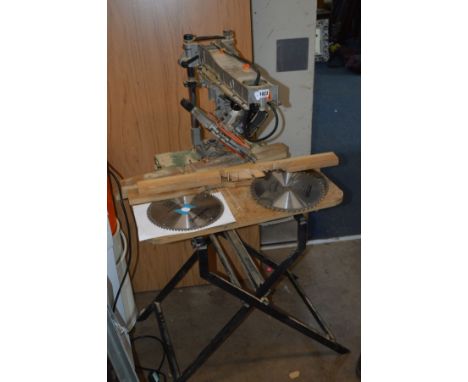 AN ISD MINIRAD RADIAL ARM SAW with 10'' blade, three spare blades, on a seperate metal folding frame, a Skill saw on a Dunlop