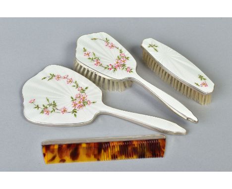 AN ELIZABETH II SILVER AND CREAM ENAMEL THREE PIECE DRESSING TABLE SET, decorated with Dog Rose, makers Adie Brothers Ltd, Bi