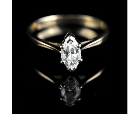 Single stone diamond ring, set with marquise cut diamond with a W.G.I certificate stating a weight of 0.60 carats, claw set i