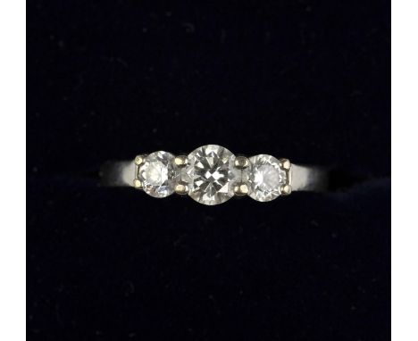 Three stone diamond ring, set with round brilliant diamonds with an estimated total weight of 1 carat, all claw set in 18 ct,