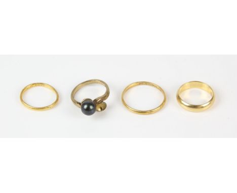 Four rings, including a 9 ct gold ring set with a pearl, with one pearl missing, a 2mm 22 ct wedding band engraved 'Betty. Wa