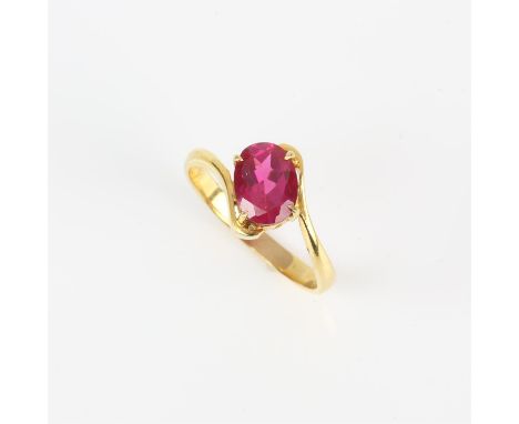 Single stone synthetic ruby ring, with oval cut synthetic ruby ring weighing an estimated 1.58 carats, diagonally claw set to