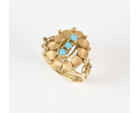 Turquoise and ruby ring, three central round cabochon turquoise stones, mounted in a floral design with rubies set to the sho