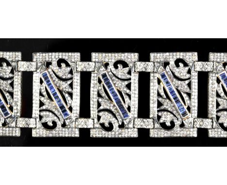 AMENDED DESCRIPTION Sapphire and diamond bracelet with seven rectangular foliate design panels set with natural and lab grown