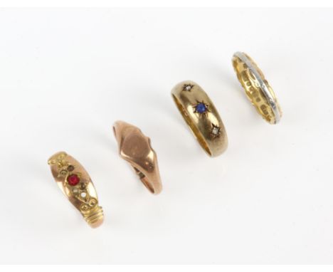 Four gold rings, including a sapphire and diamond three stone ring in 18 ct, size J, a bicolour band ring in 18 ct size J, a 